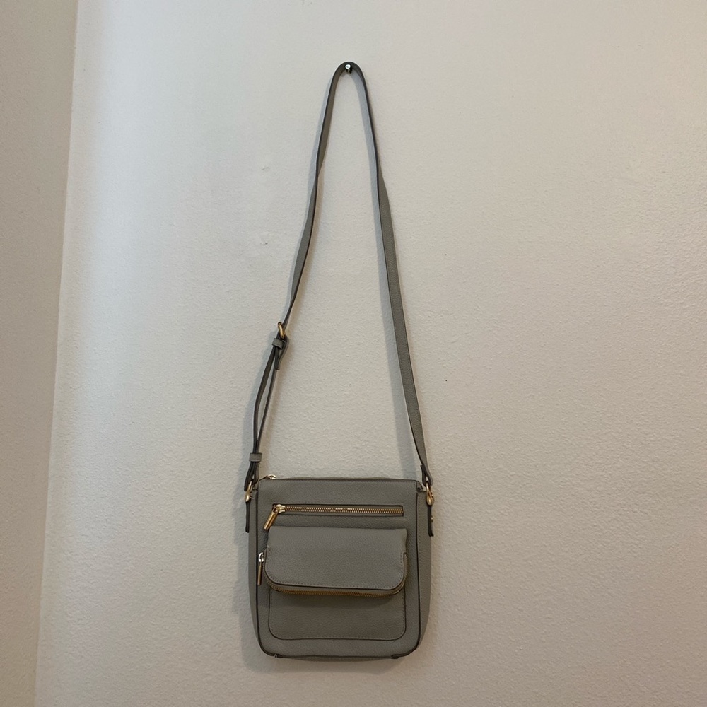 blue/grey cross body bag with lots of pockets